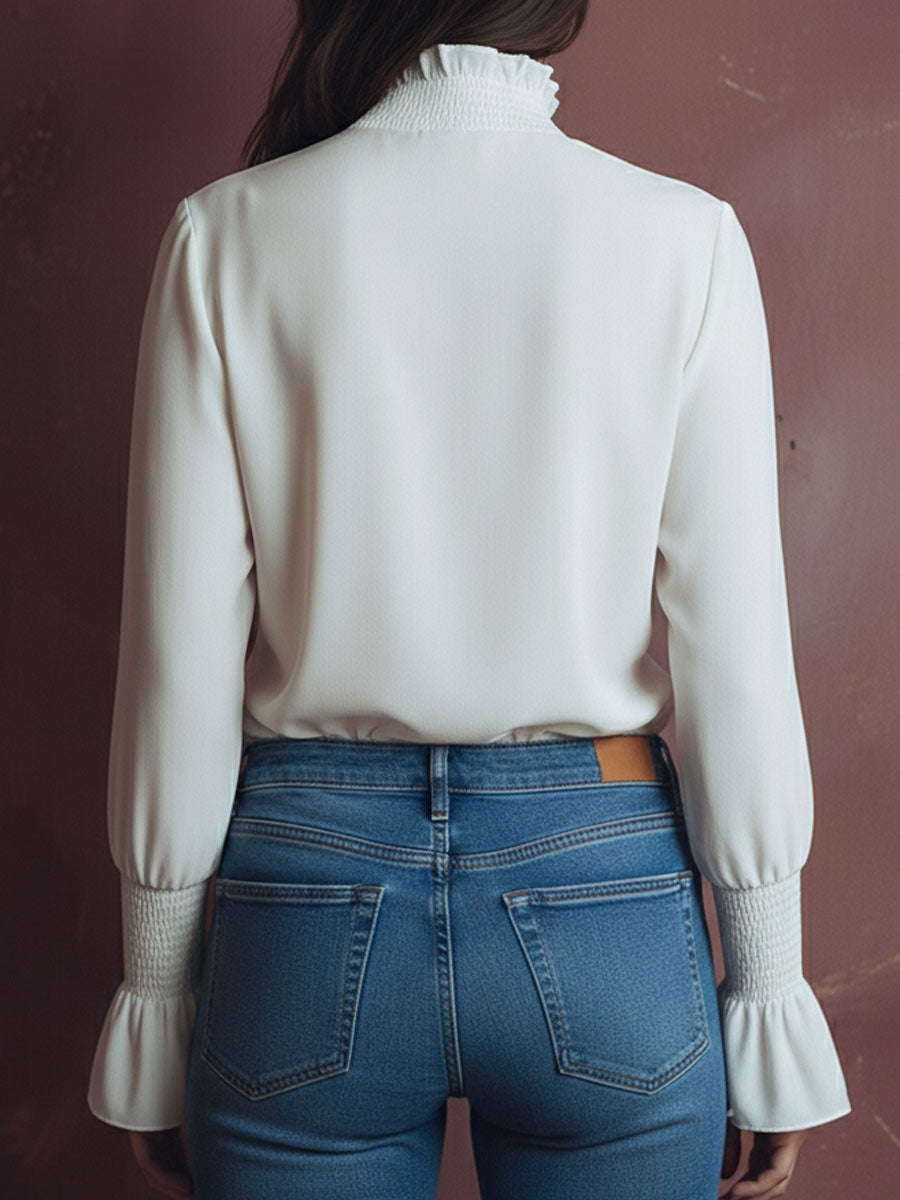 Elegant High Neck White Blouse With Smocked Cuffs And Ruffle Details