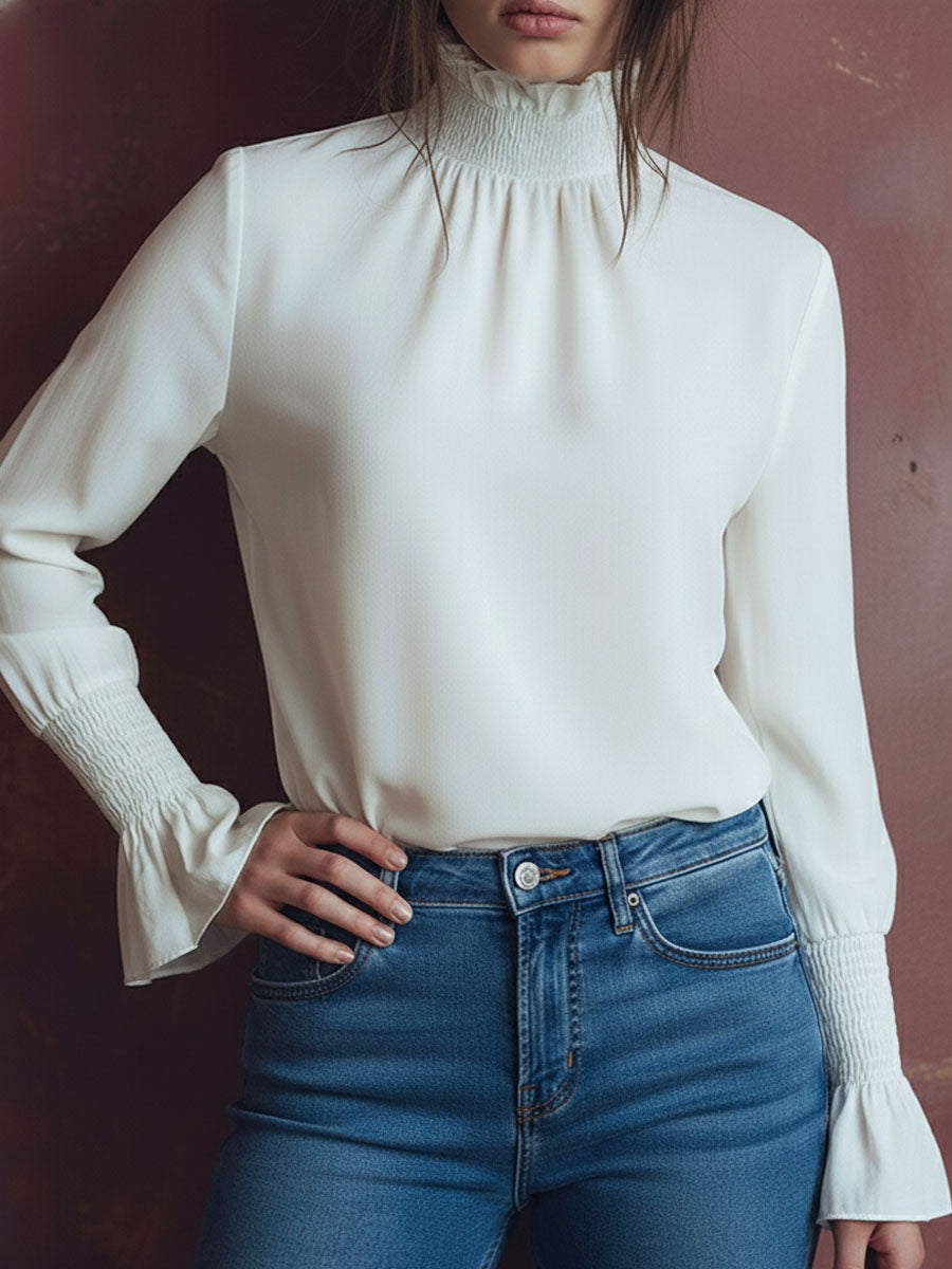Elegant High Neck White Blouse With Smocked Cuffs And Ruffle Details